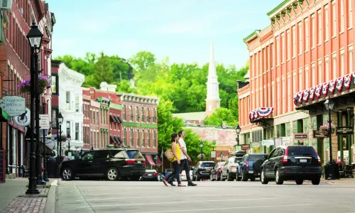 People walking across street in town