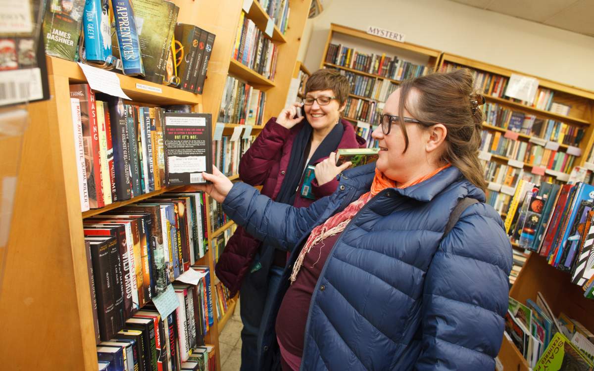 People shopping for books at Women & Children First.