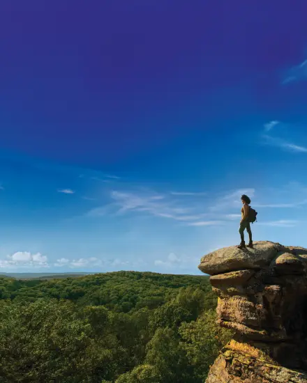 A person standing on top of Camel Rock.