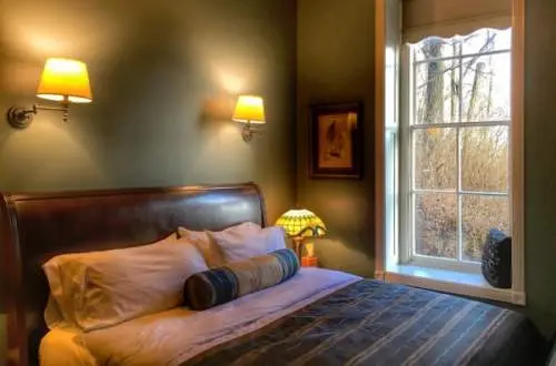 A bedroom with a window view