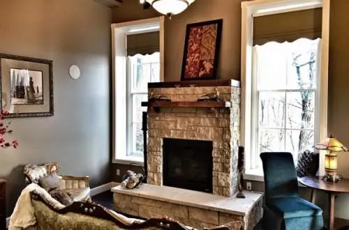 Lounge with fireplace and windows