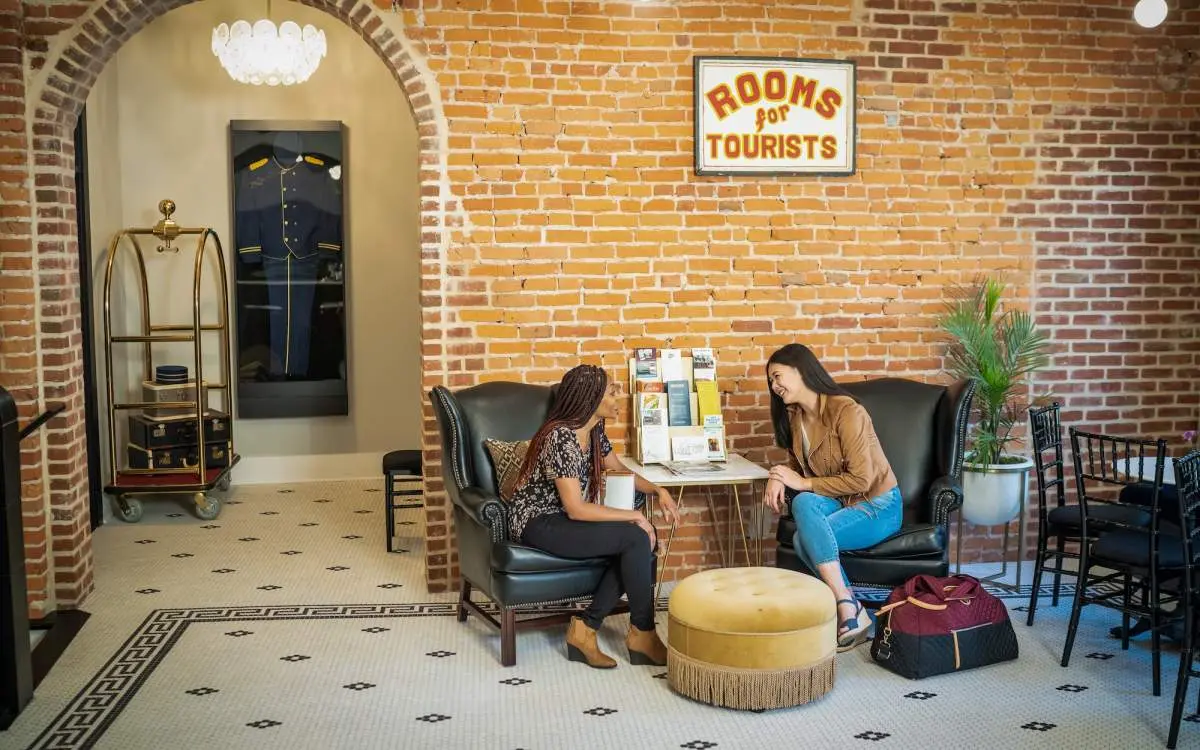 Two women talking in a hotel lobby