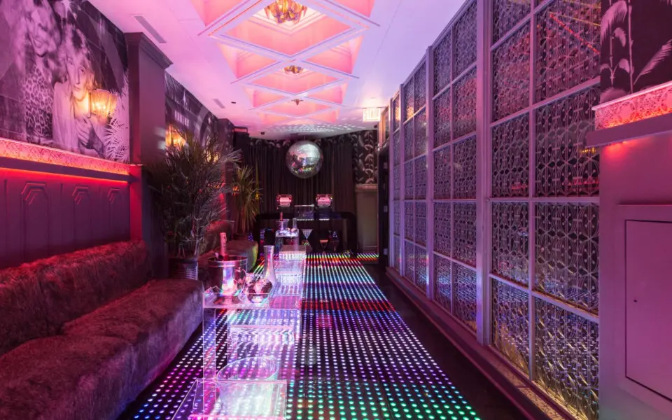An empty, lit up and colorful dance floor