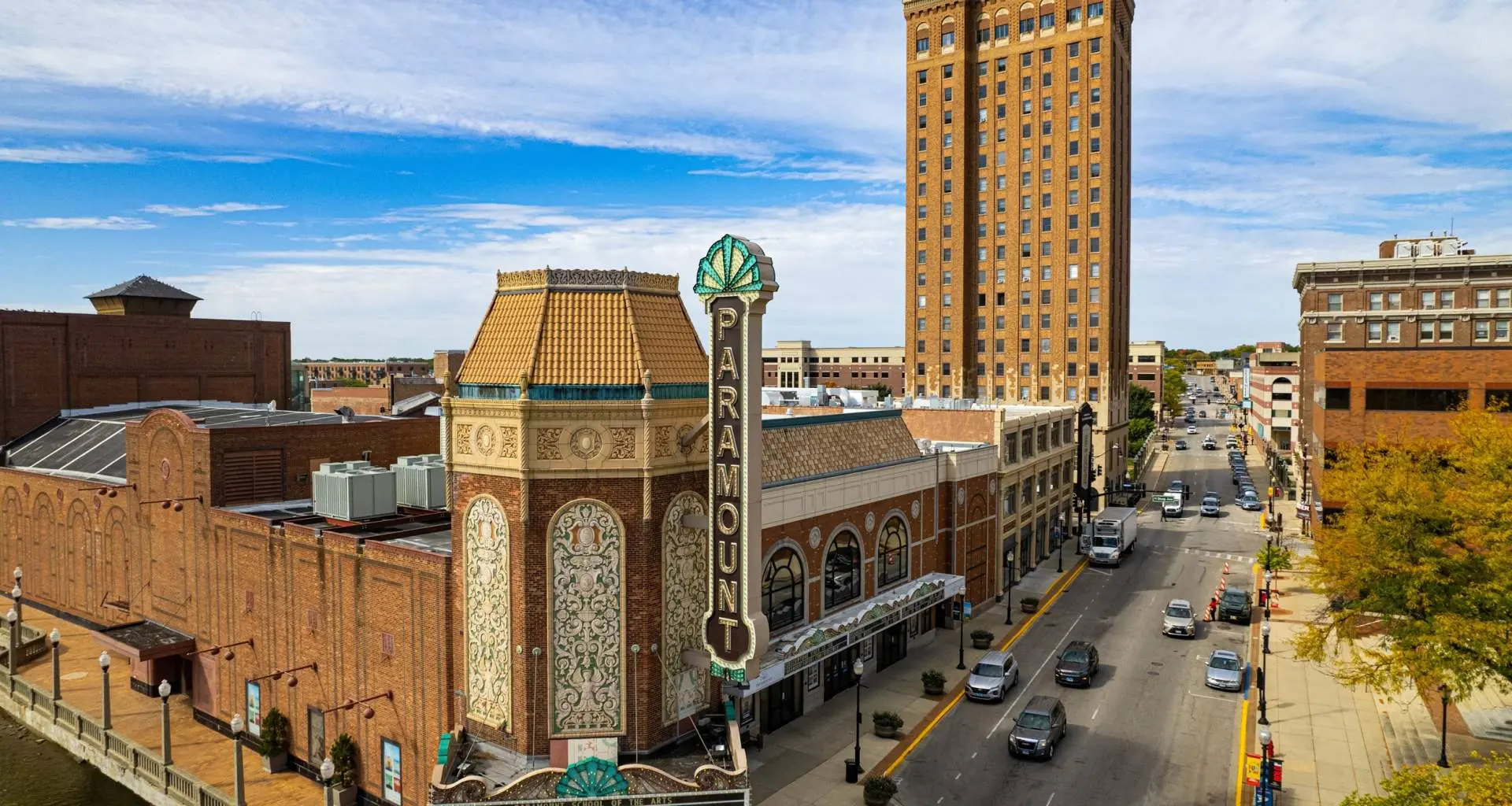 A downtown street in Aurora, the Paramount Theater in foreground
