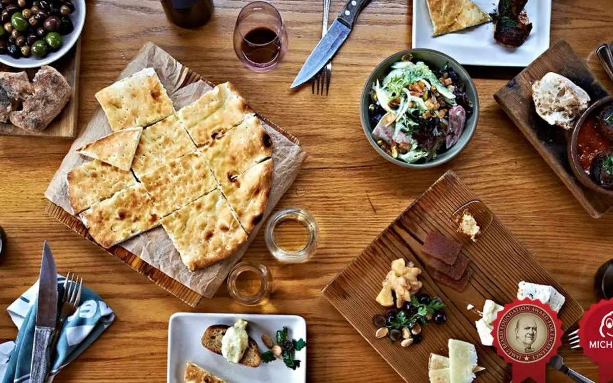 Aerial shot of Avec's dishes - an assortment of Mediterranean dishes.