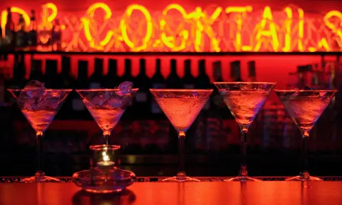 Martini glasses on the counter at a swanky speakeasy
