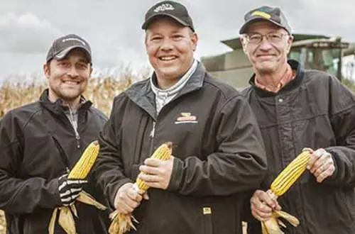 Men holding corn