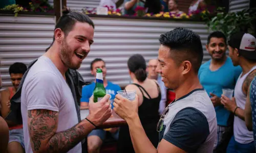 Two men drinking at a bar