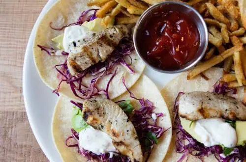 Tacos and fries on a plate