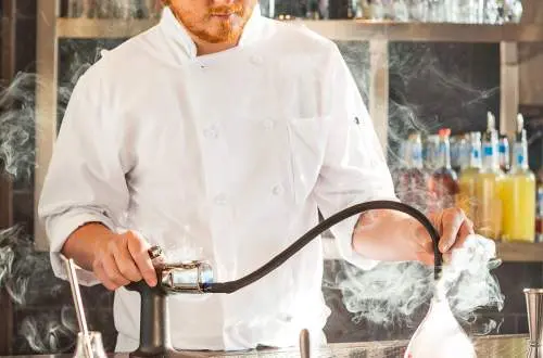 Man with chemical smoke sprayer