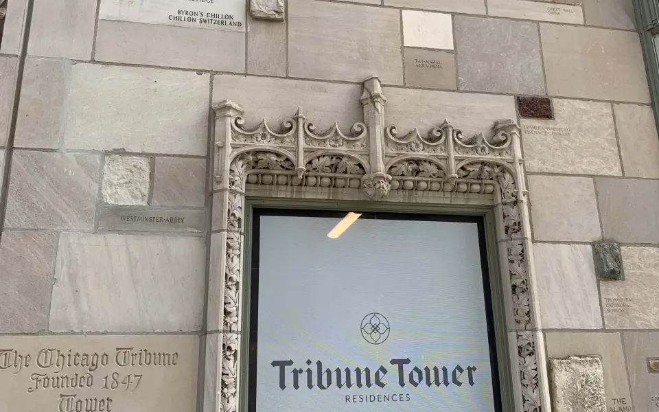 Outside of the Chicago Tribune tower with historic building artifacts