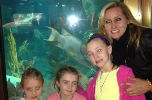 Family in front of the fish tank