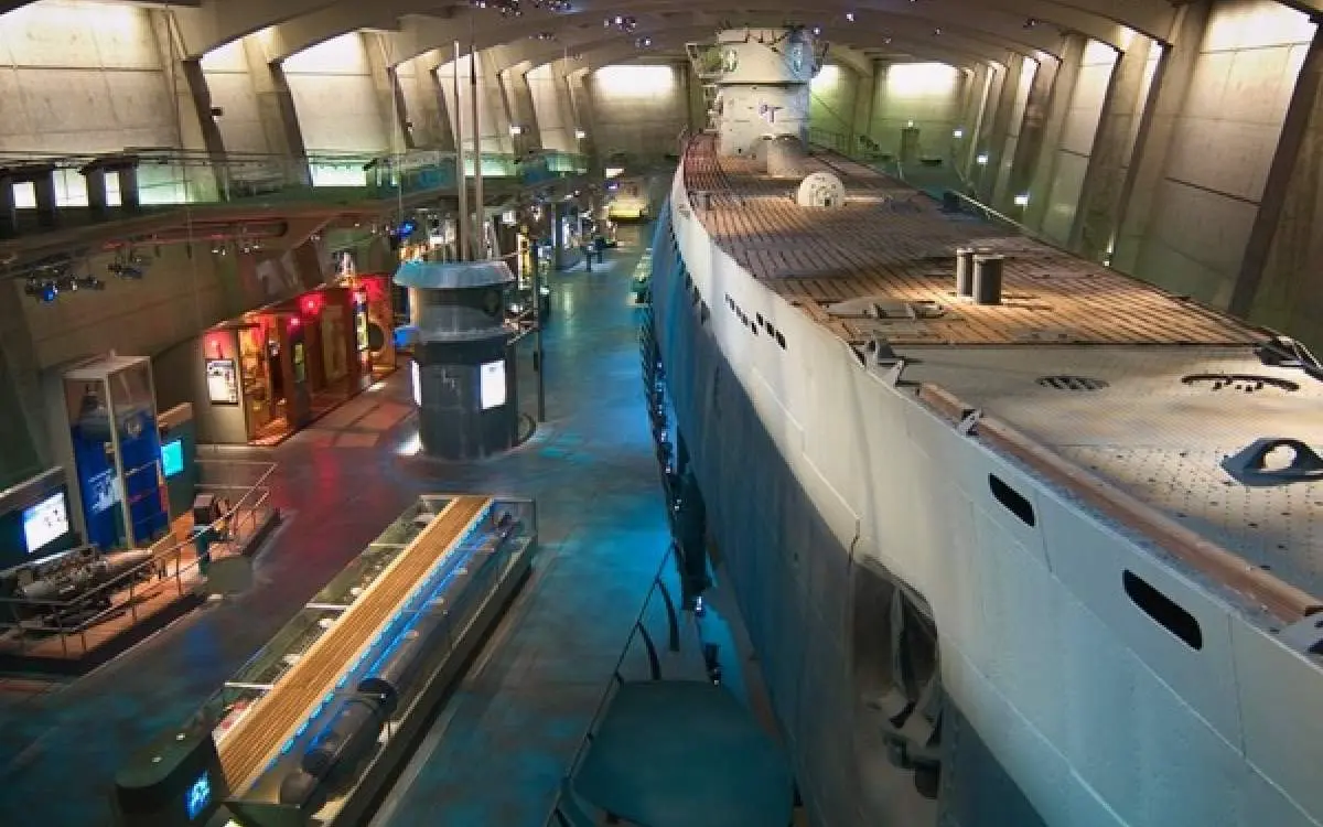 Inside a large room with a ship