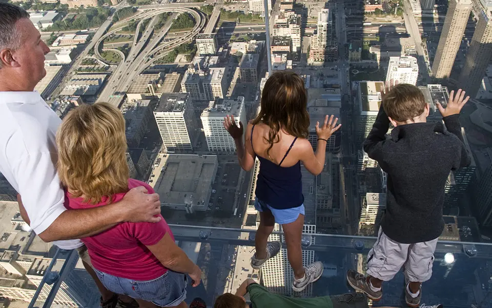 People looking down at building below