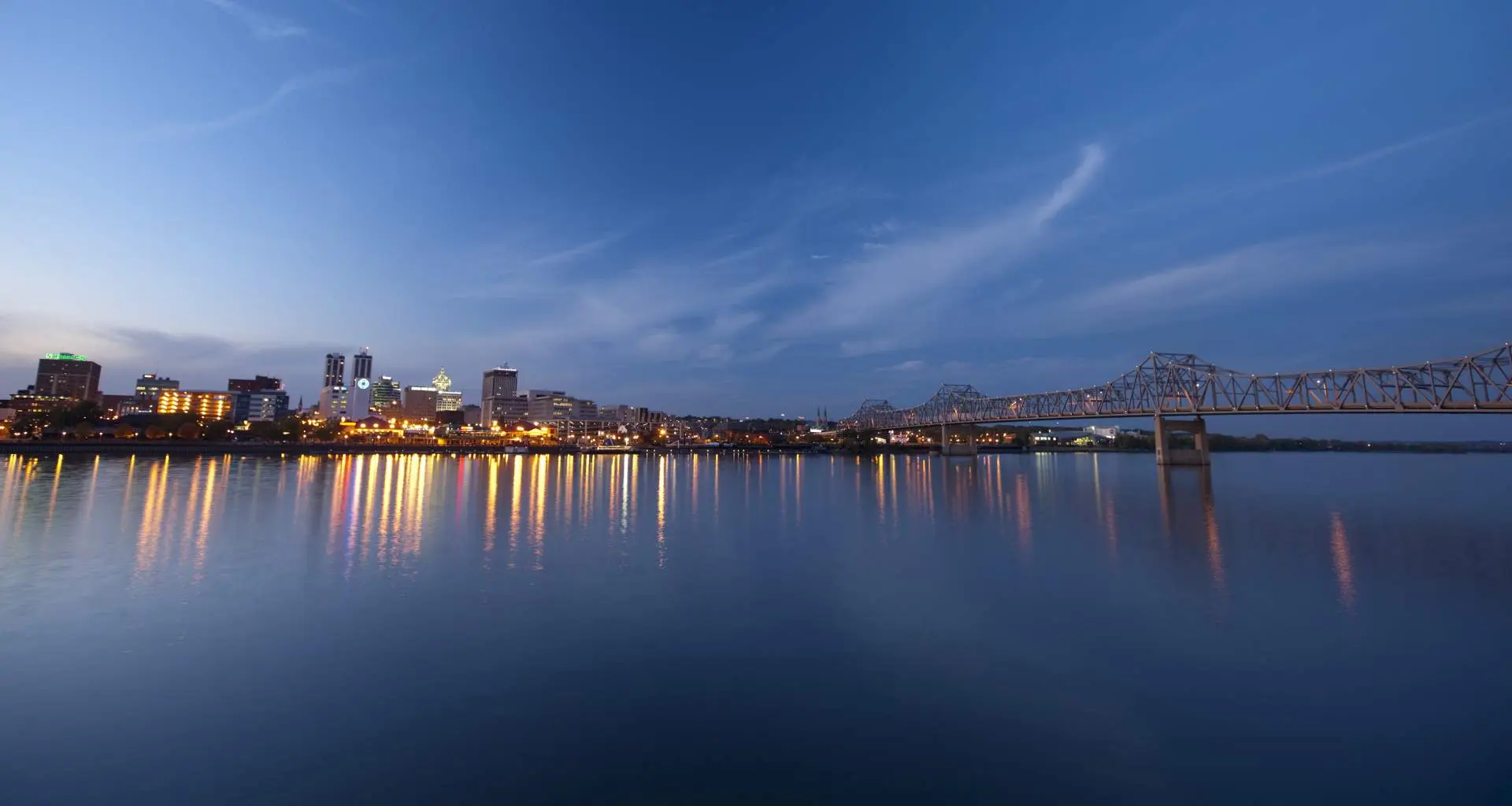 River with city and lights behind it