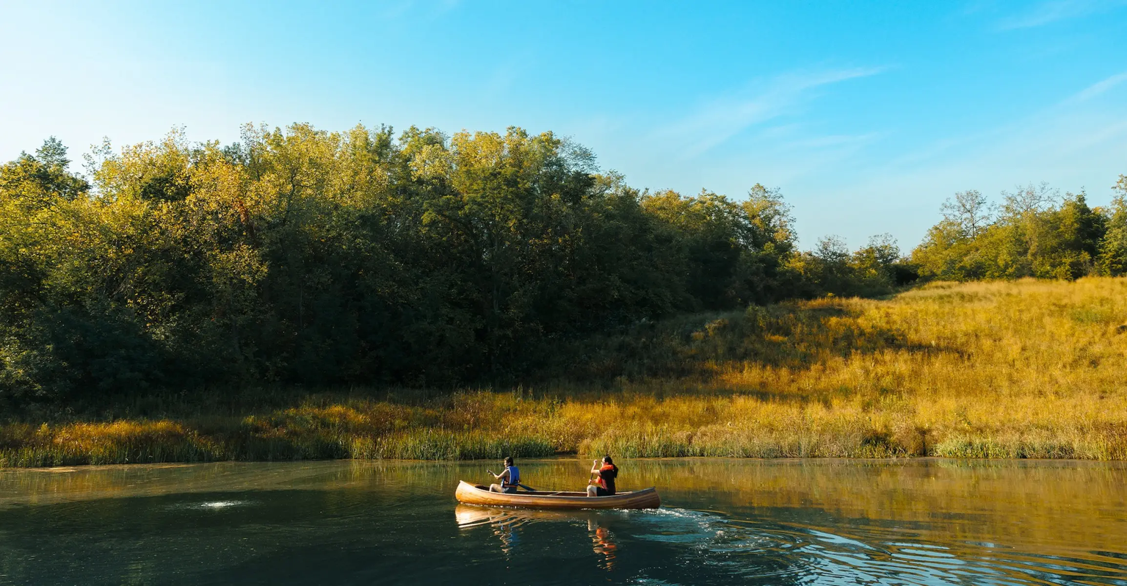 Two people in a canoe on a river