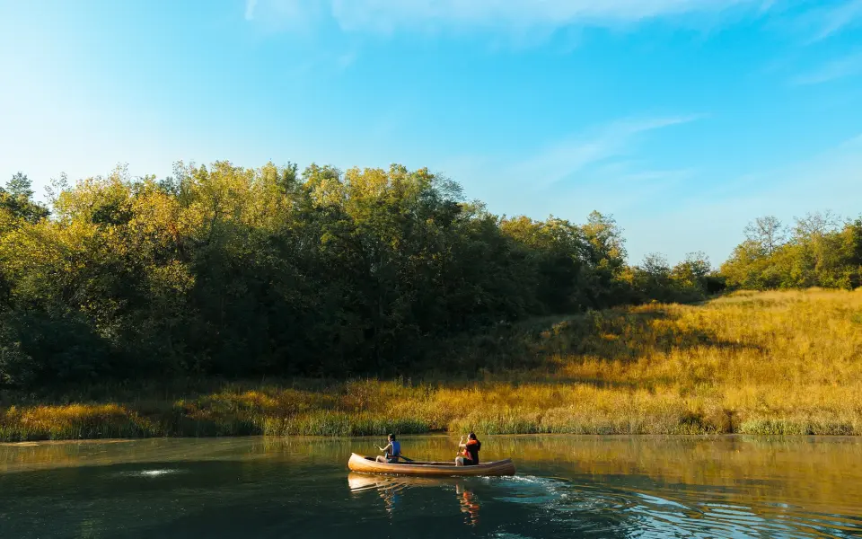 Two people in a canoe on a river