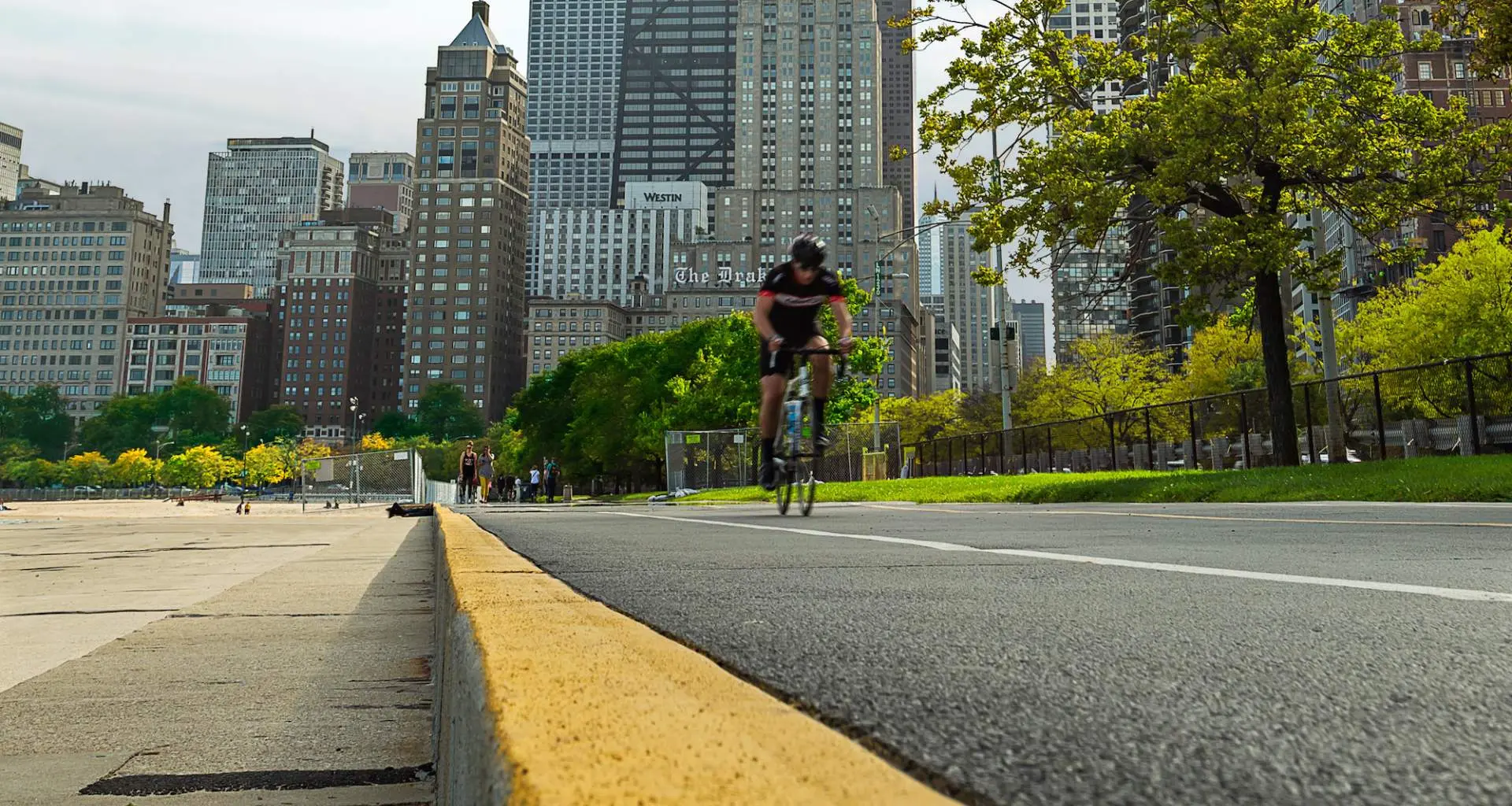 Road cyclist on the lakefront bike path in Chicago with the city in the background