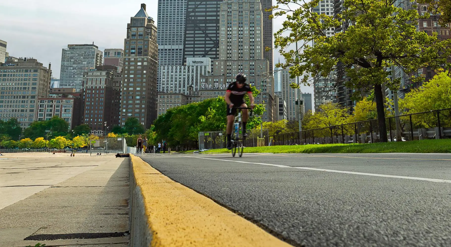 Road cyclist on the lakefront bike path in Chicago with the city in the background