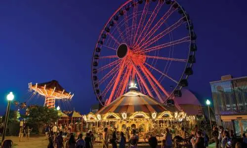 The Ferris Wheel illuminated in the evening