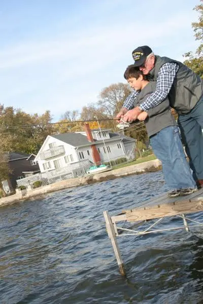 Grandfather and kid fishing