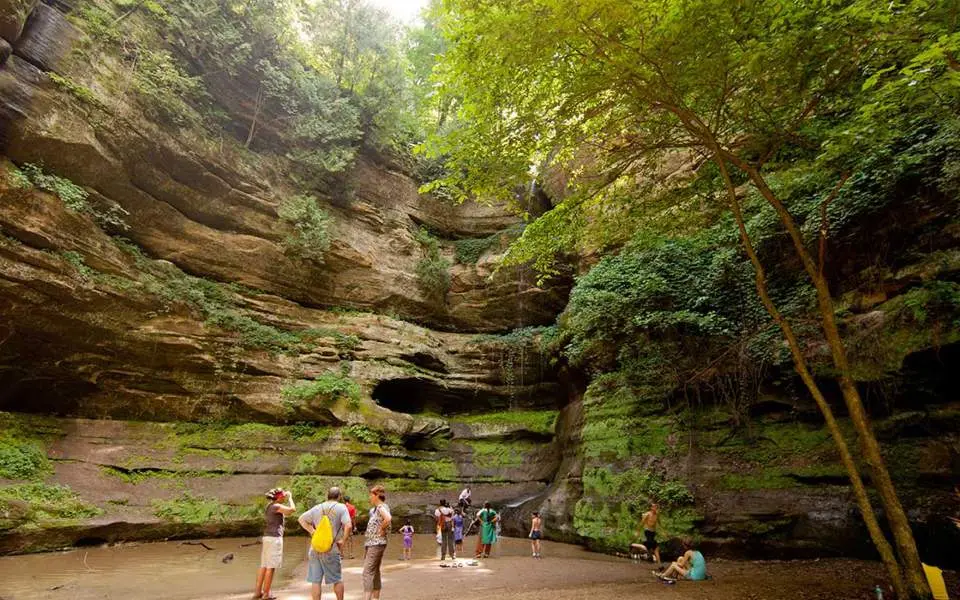 Hikers resting and admiring the waterfall