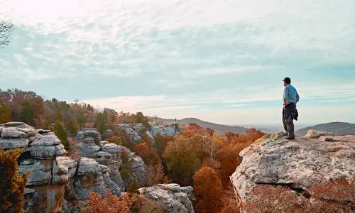 Man standing on top of a rock at Garden of the Gods