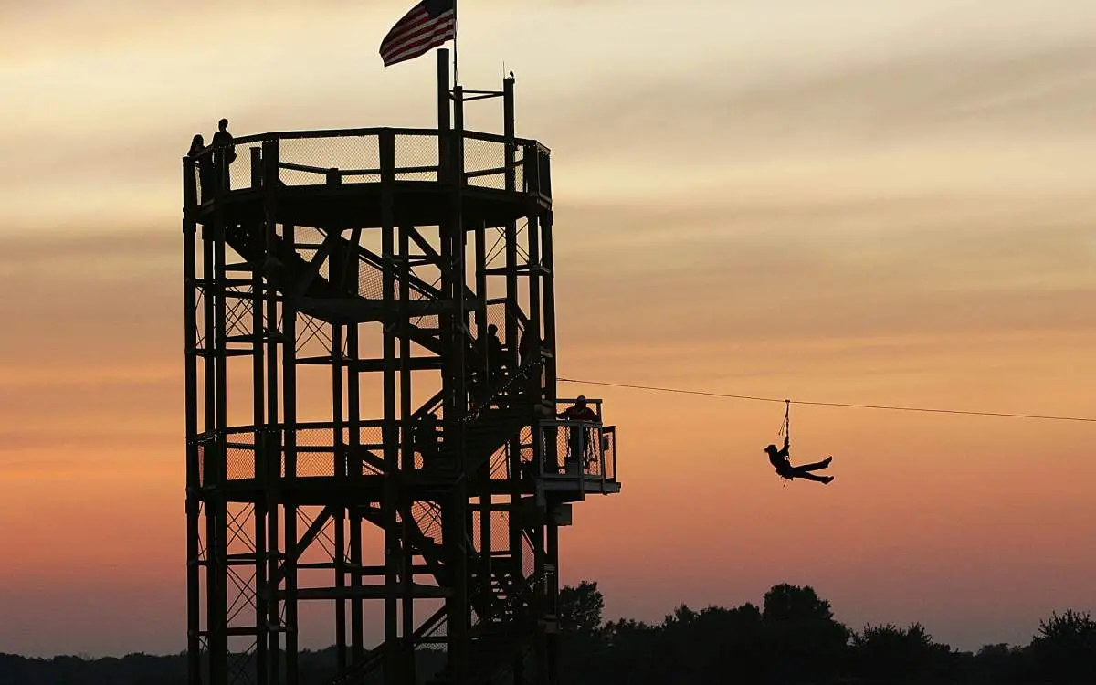 Person going down a high flying fox