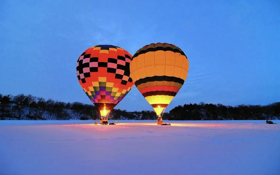 Glowing air balloons in the snow