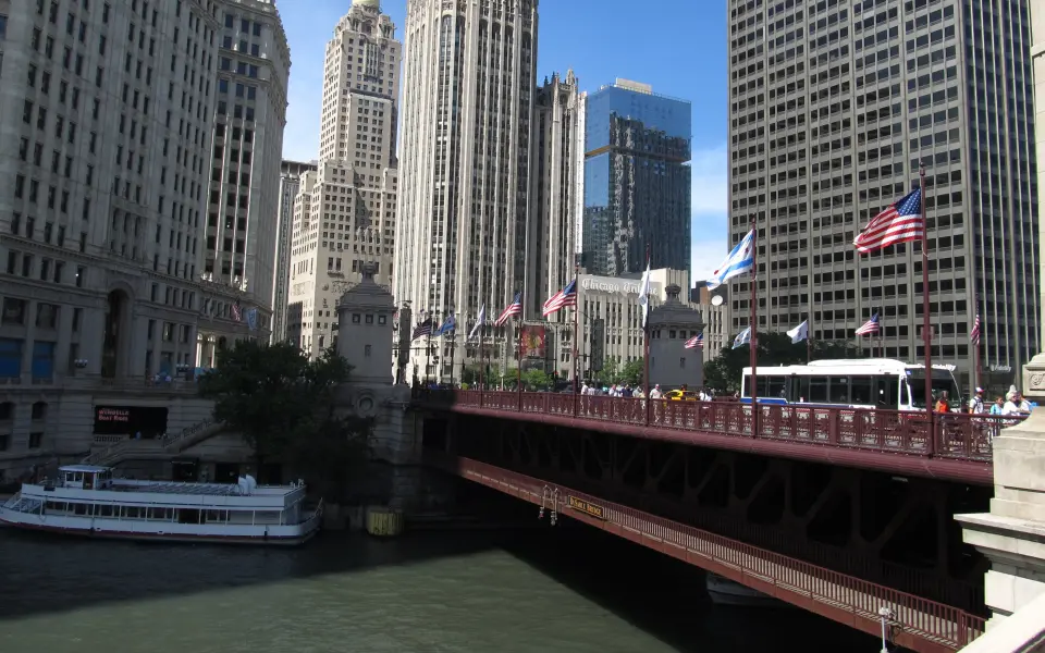 A bridge with big city buildings around it