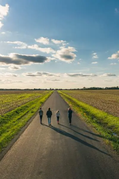 Craig Hensel's family stroll along a country road at the Great Pumpkin Patch, Illinois.
