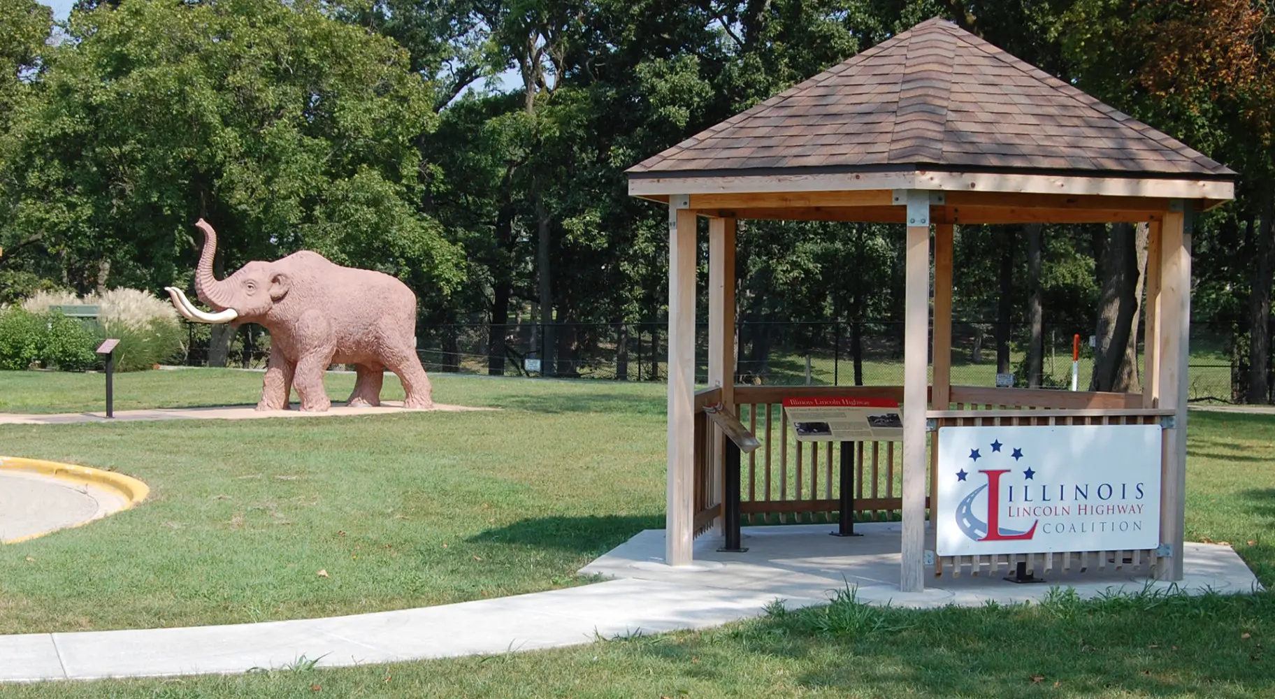 A pavilion with an elephant statue in the background