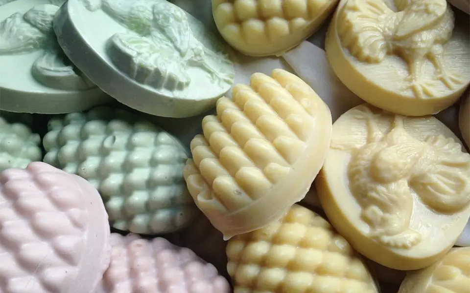 Assorted shapes and colors of natural soaps