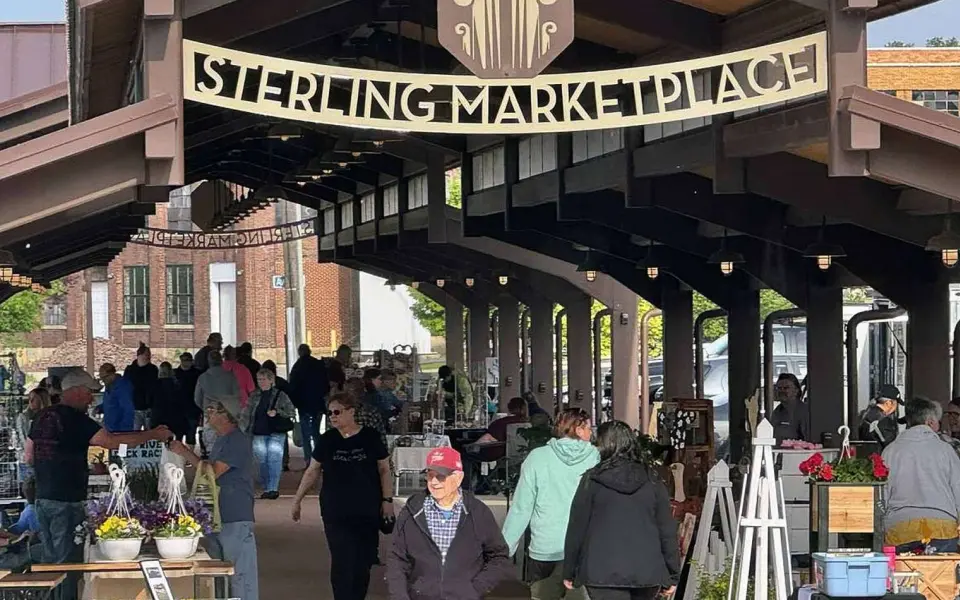 People walk through a market