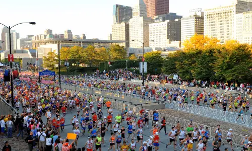 Lots of runners running along the street