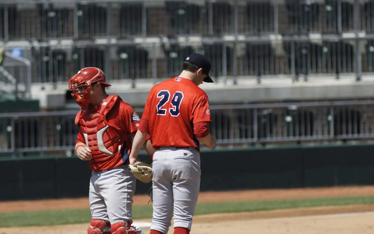 Peoria Chiefs players congregate on the mound